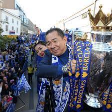 Vichai Srivaddhanaprabha posing for the photo with the cup