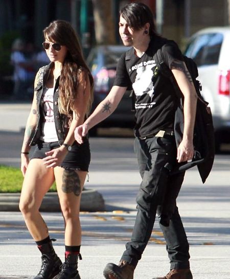 Alex Aniston with his girlfriend