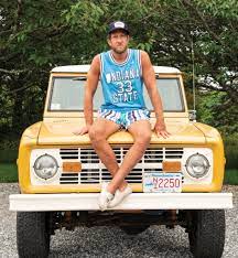 Dave Portnoy posing for a photo with his car