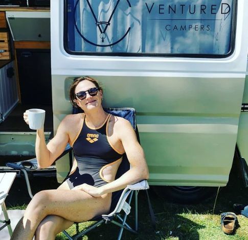 Cate Campbell posing with a van