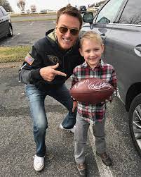 Michael Smith posing for a photo with his son