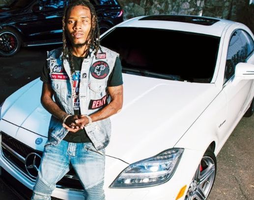 Fetty Wap posing with his car