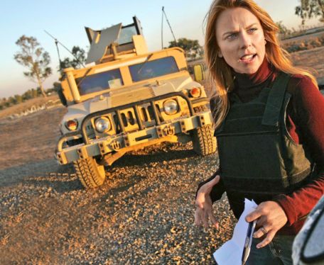 Jason Siemon's ex-wife, Lara Logan posing with a vehicle
