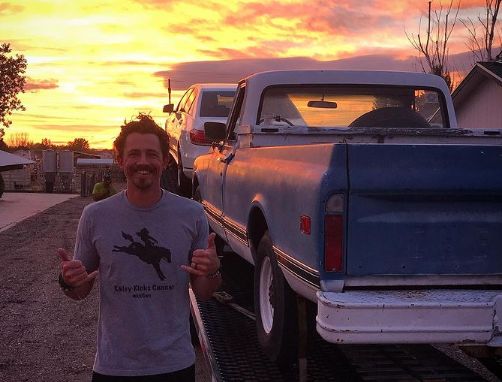Joe Anglim posing with his car