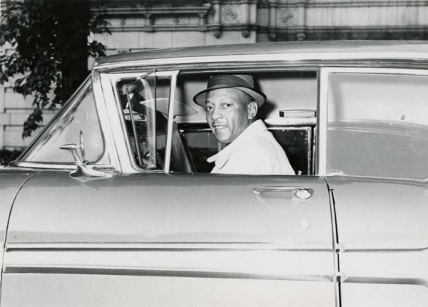 Jesse Owens sitting inside the car
