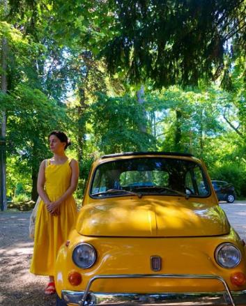 Phoebe Fox posing with her car