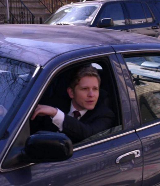 Matt Czuchry sitting inside the car