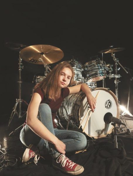 Sina Doering posing for a photo with drums