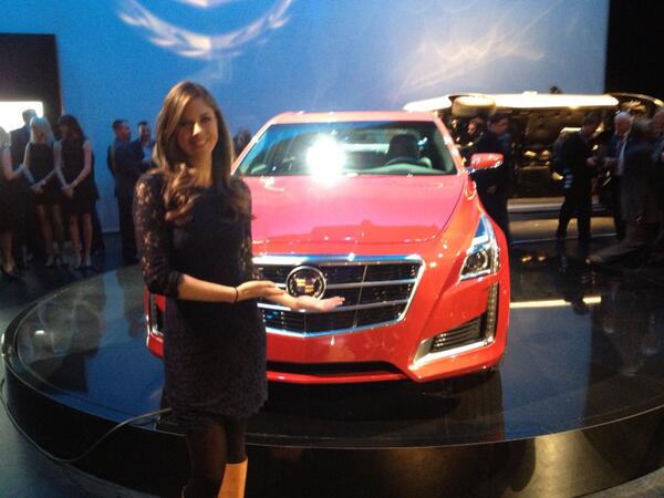 Abby Huntsman posing for a photo with her car