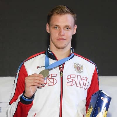Anton Borodachev posing for the photo with medal