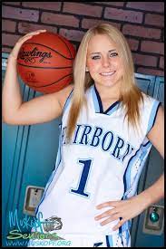 Brooke Pumroy posing for the photo with basketball 