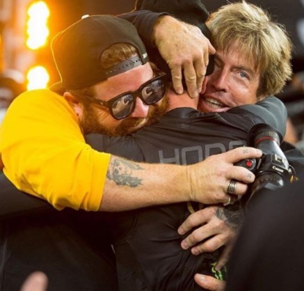 Axell Hodges hugging his brothers