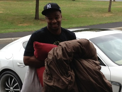 Osi Umenyiora outside his car