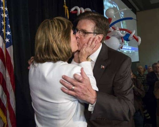 Dan Patrick kissing his wife, Susan Patrick