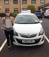 Jade McCarthy standing outside her car