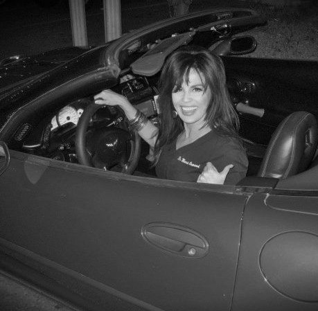 Marie Osmond posing with her car