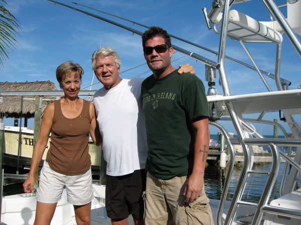 Jimmy Johnson posing for a photo with his children