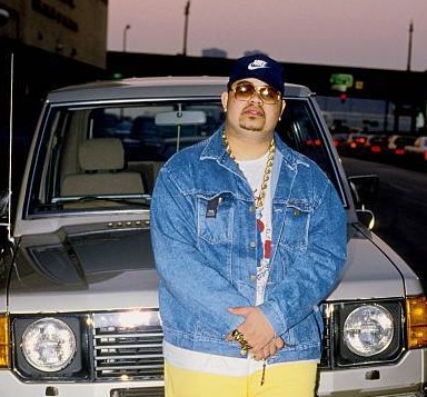Xea Myers's father, Heavy D posing with his car