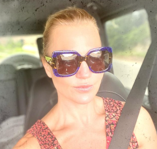 Michelle Beadle sitting inside her car
