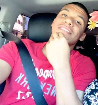 Juan Soto sitting inside his car