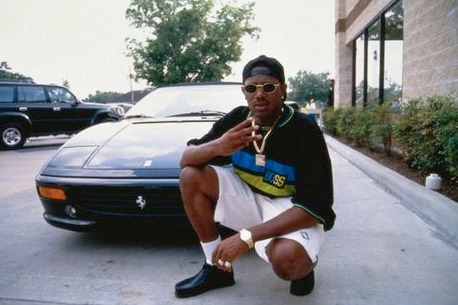 Cymphonique Miller's father, Master P posing with his car
