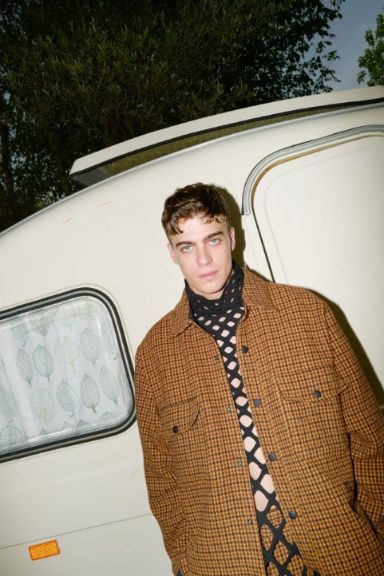 Lorenzo Zurzolo posing with a vanity van