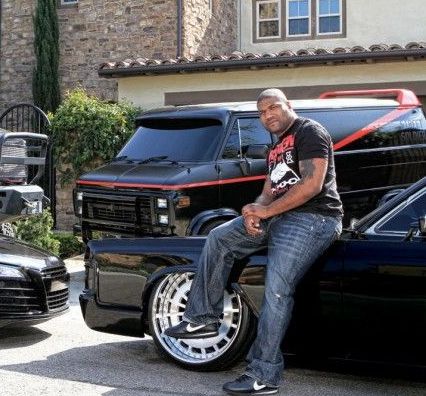 Rampage Jackson posing with his car