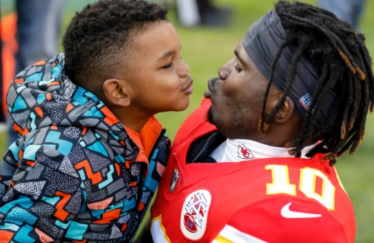 Tyreek Hill with his son