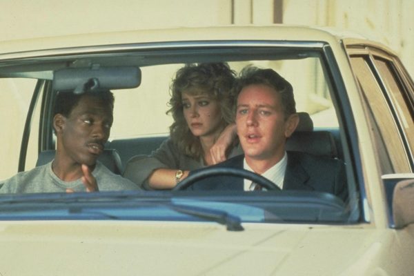 Lisa Eilbacher siting inside the car with her co-actors