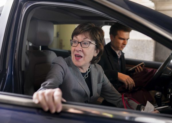 Susan Collins sitting inside her car