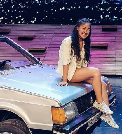 Gab Pangilinan posing with a car
