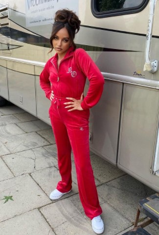 Jade Thirlwall posing with a vanity van