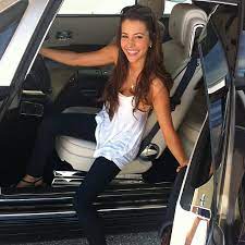 Shelby Chesnes sitting inside her car