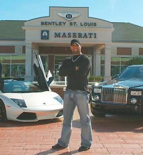 Albert Pujols standing outside his car
