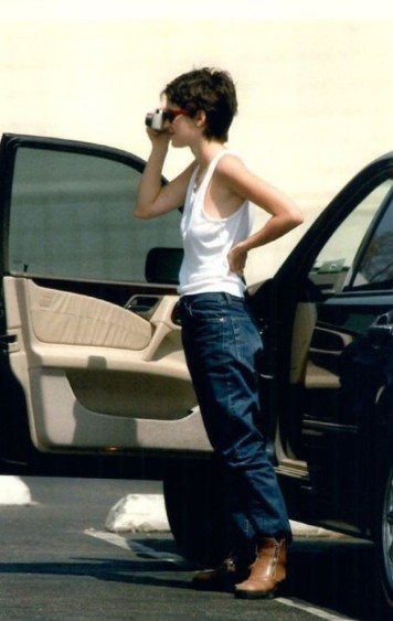 Winona Ryder posing with her car