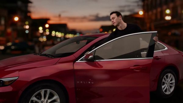 Patrick Kane posing for a photo with his car