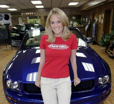Carrie Underwood with the car 