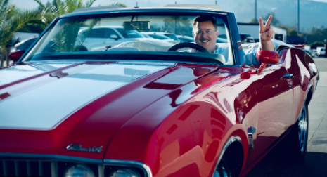 Billy Gardell sitting inside his car