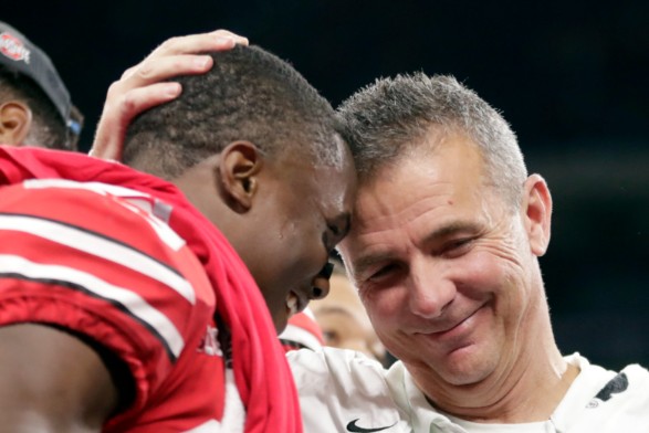 Urban Meyer with his player