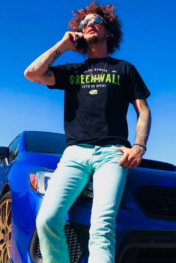 Danya Gonzalez's boyfriend, Sean O'Malley posing with his car