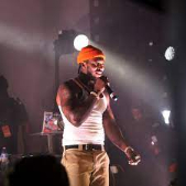 Pardison Fontaine singing at the stage