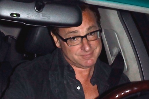 Sherri Kramer's ex-husband, Bob Saget posing inside his car