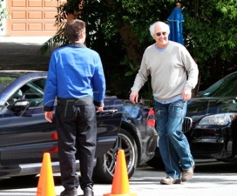 Chevy Chase outside his car