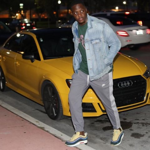 Teddy Bridgewater posing with his car