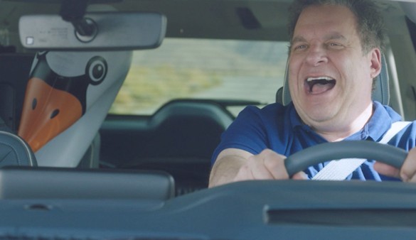Jeff Garlin sitting inside his car