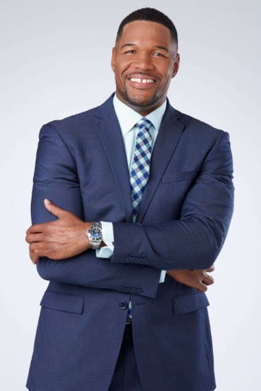 Michael Strahan posing for a photo 