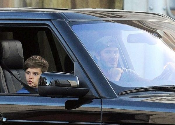Romeo Beckham inside the car