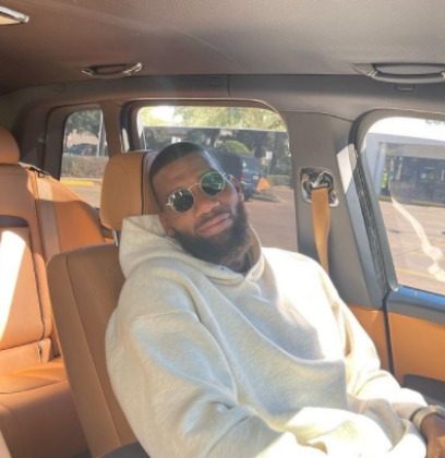 Greg Monroe taking picture in his car