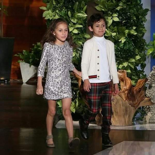 Emme and her brother posing for the photo 