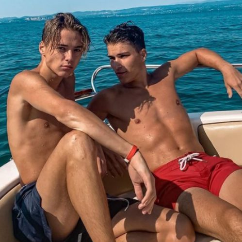 Mark enjoying boat ride with his friend